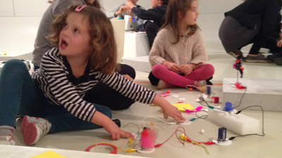 5 years old kid playing with a motor circuit